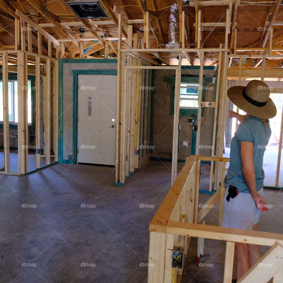 Woman exploring a newly built house.