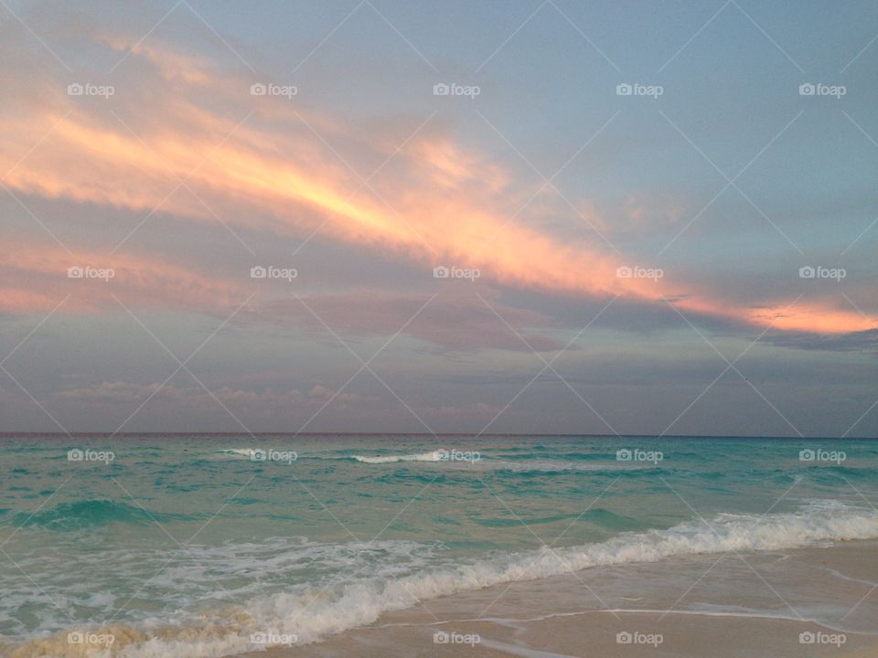 Gorgeous sunset over the ocean and beach in Cancun, Mexico!