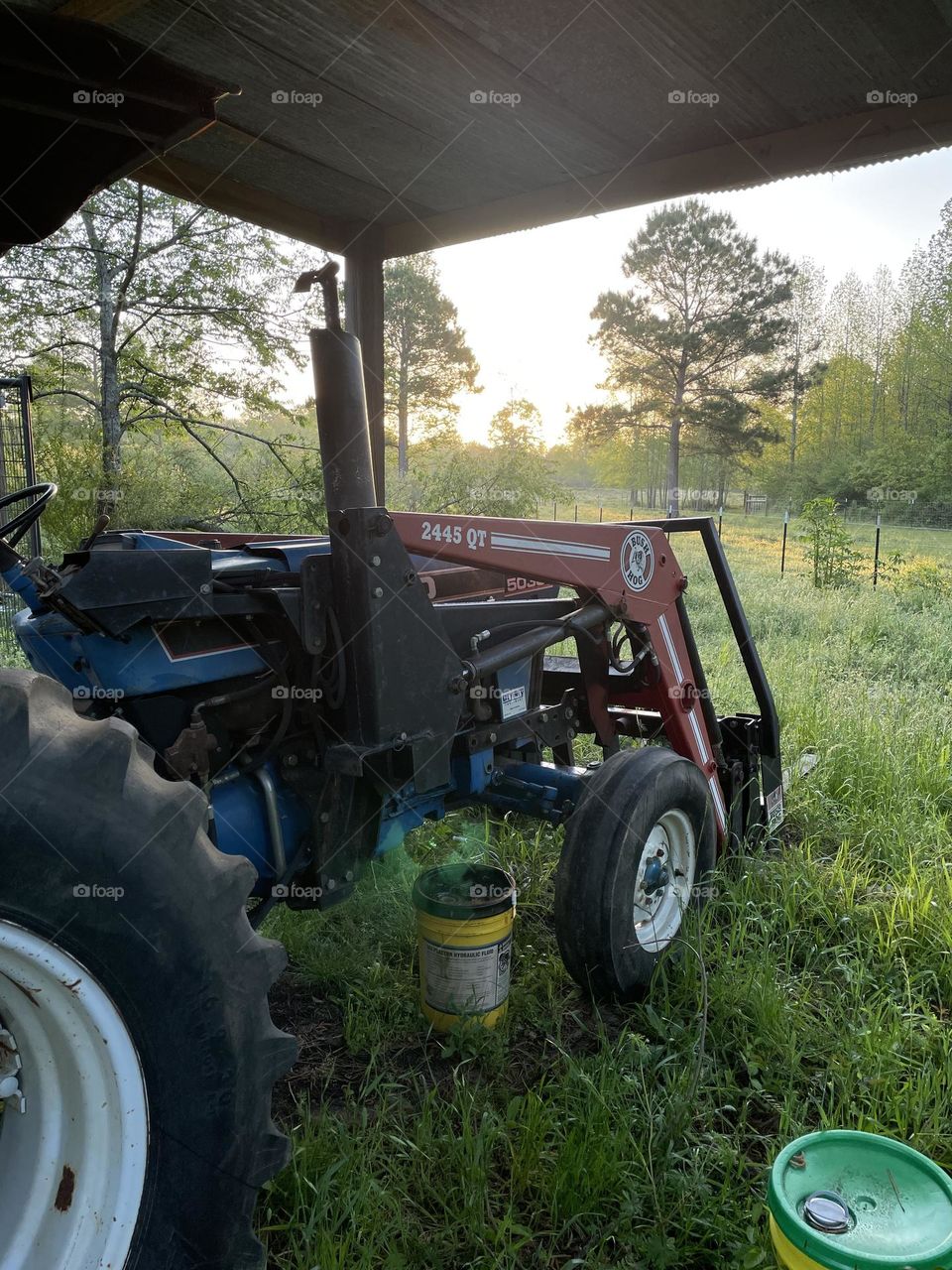 A tractor and the rising sun. 