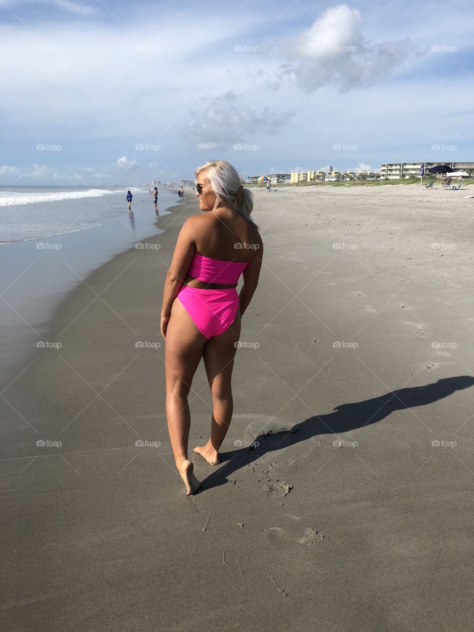 Hot pink bikini beach girl soaking up some Florida sunshine.