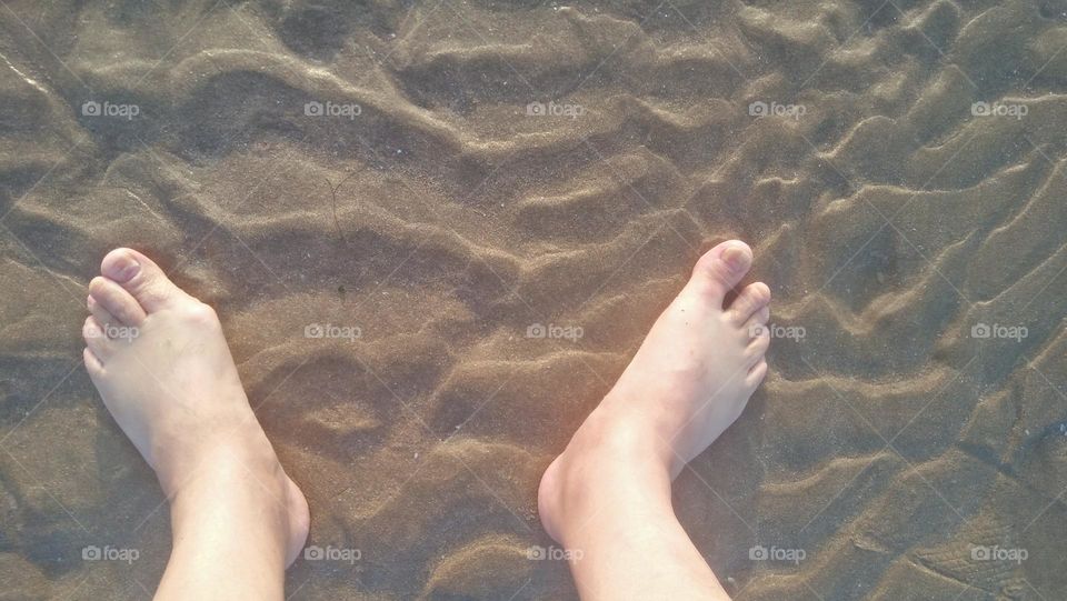 my feet on sand.