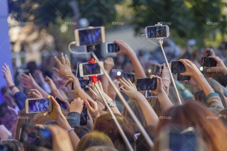 Fans cheering upvat the concert in summer