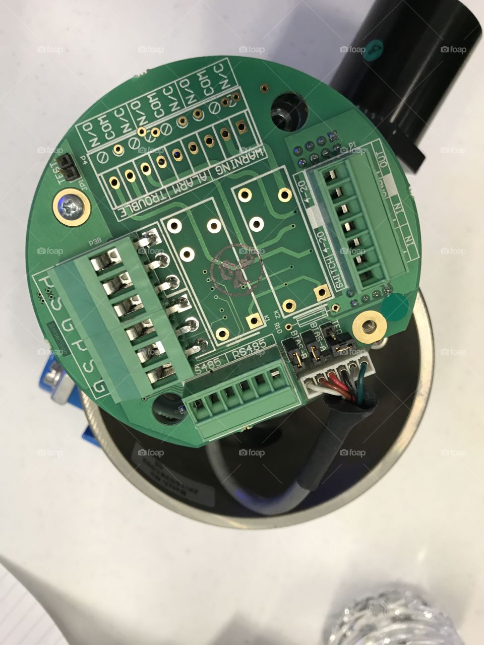 Close up of green and round circuit board 