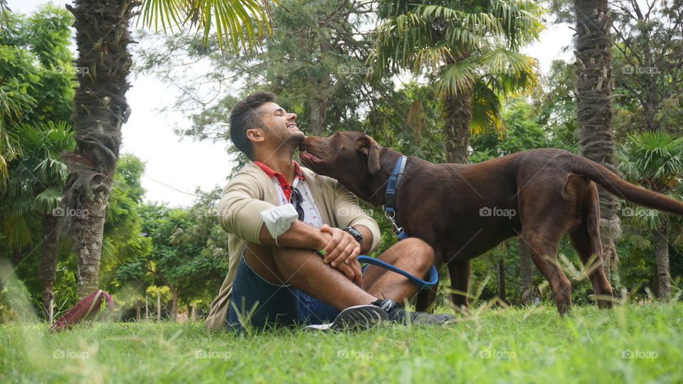 Greenarea#nature#human#dog#pet#animal#trees#palms#kiss