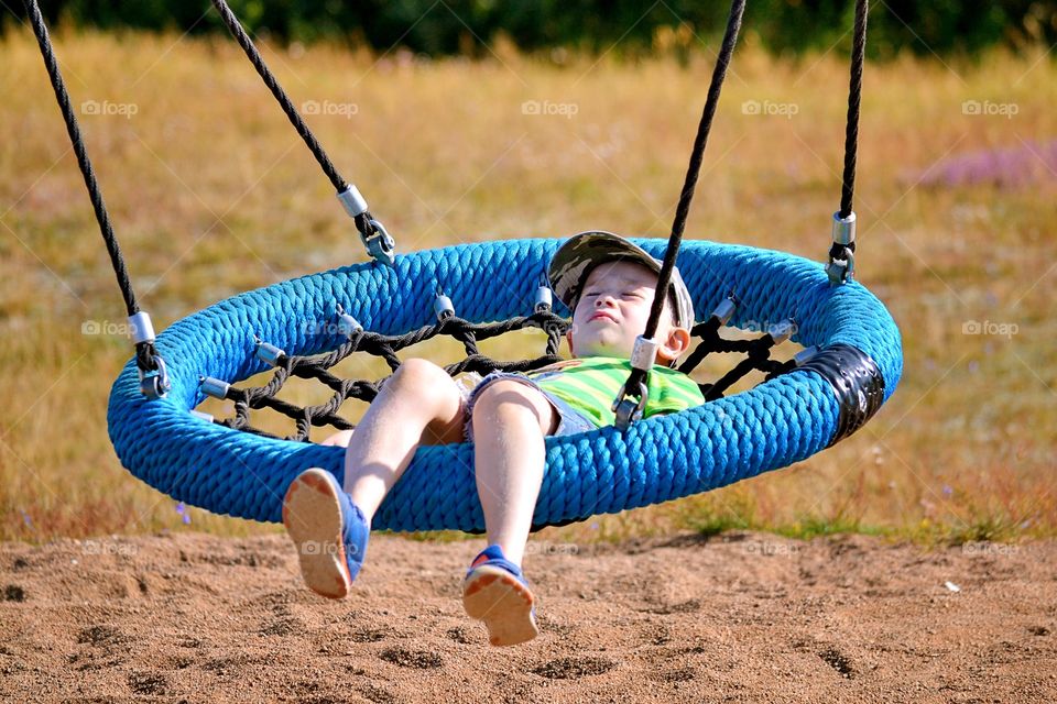 Boy swinging