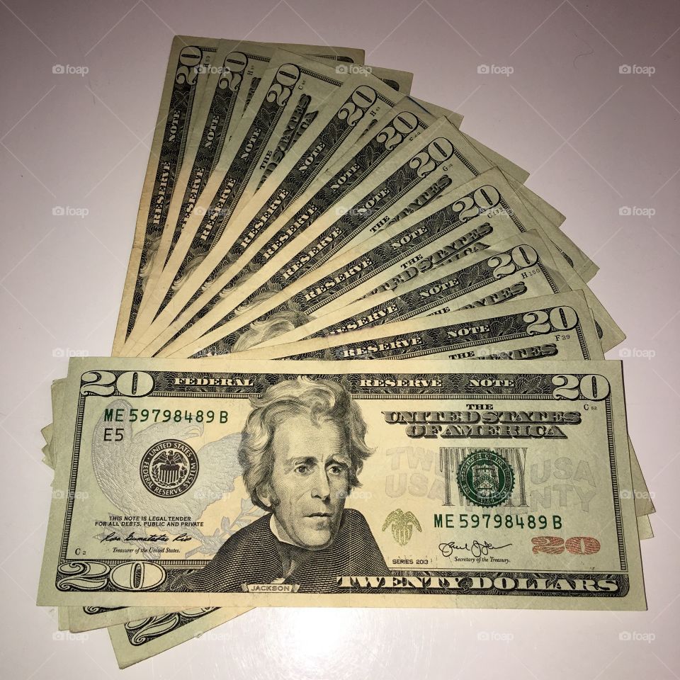 $20 bills on a table, U.S. currency.