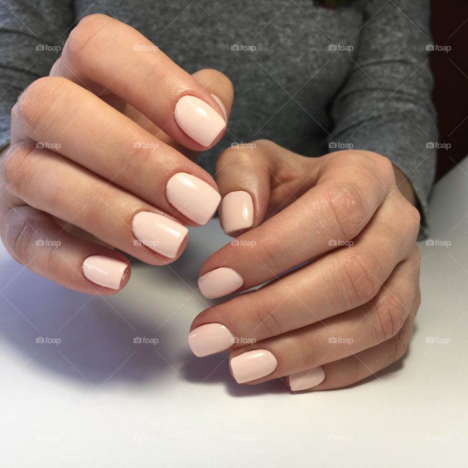 Painted nails, gel polish on nails, women's beautiful and neat manicure