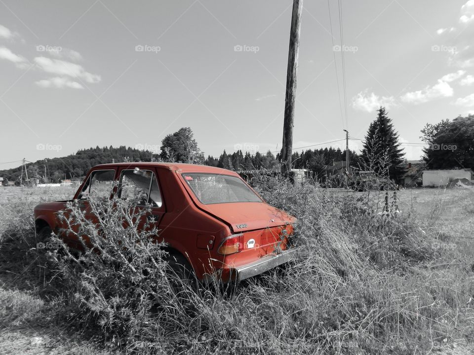 Old car left by the road