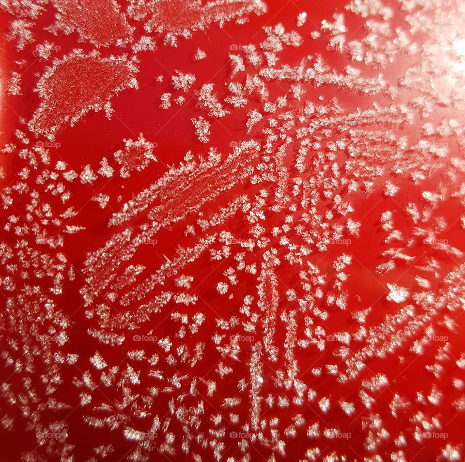 Red surface covered in frost