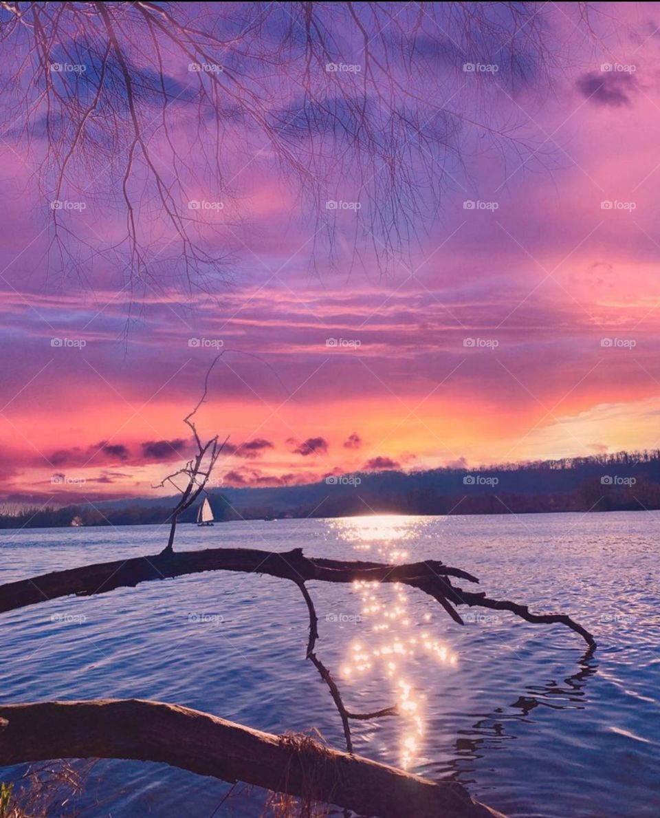 A day in Nederland. Sailing boat on a lake . Sunset view shadow on the water .