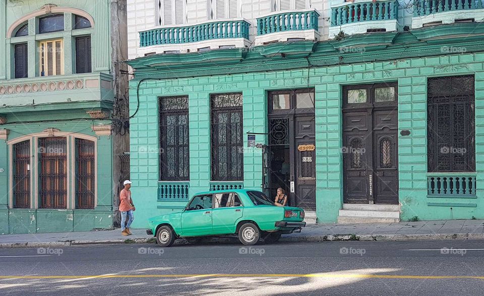 Turquoise car and house
