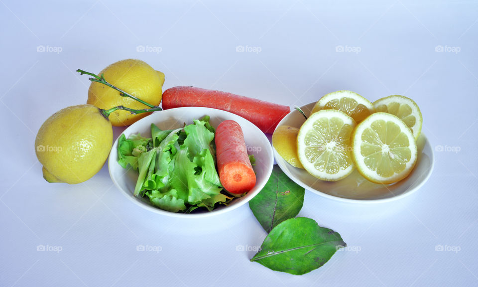 High angle view of lemons with carrot