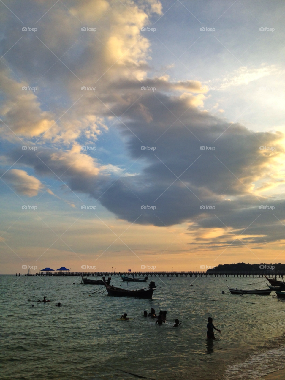 pier people sunset clouds by twilite