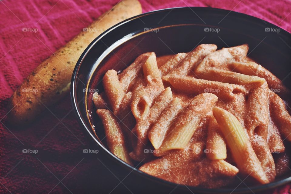 High angle view of pasta with breadstick