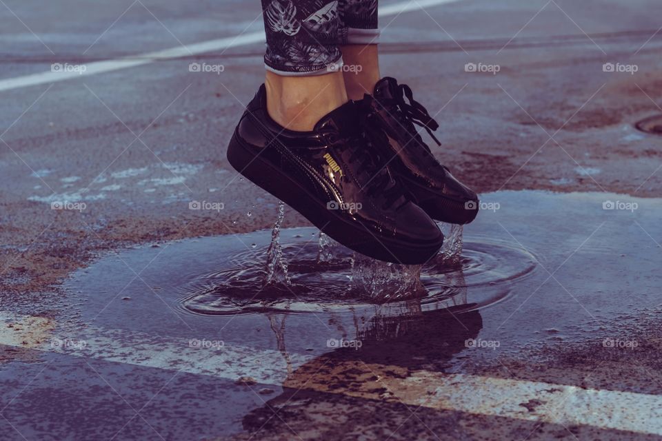 puma shoes in puddle