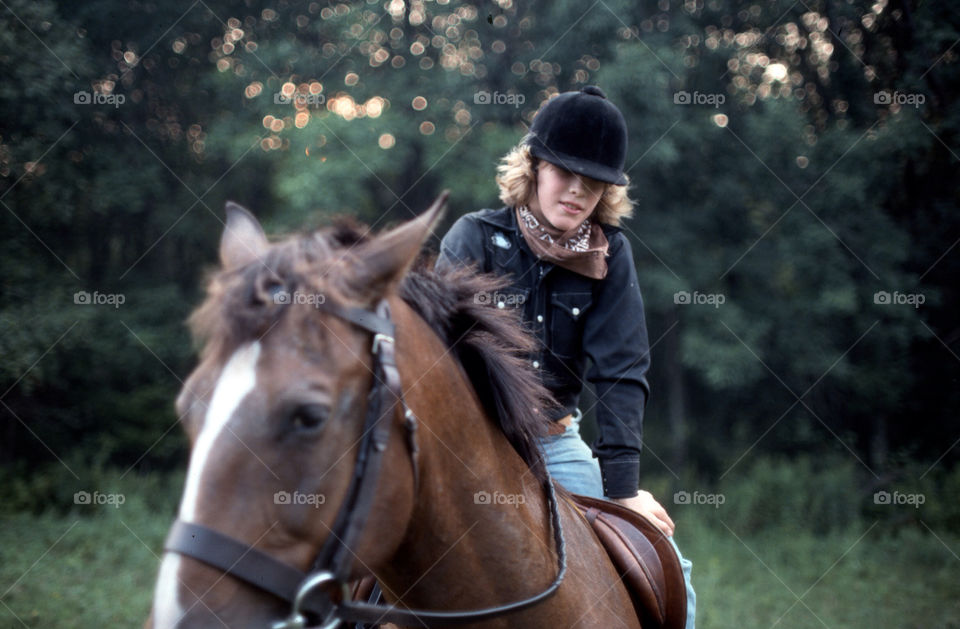 Young boy rides English style on his Appaloosa