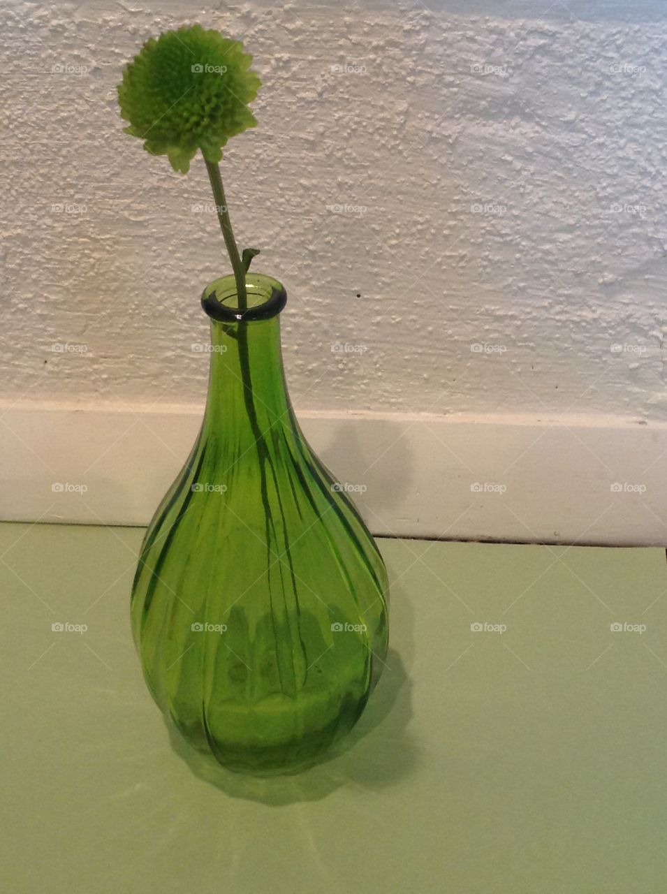 A green glass vase.