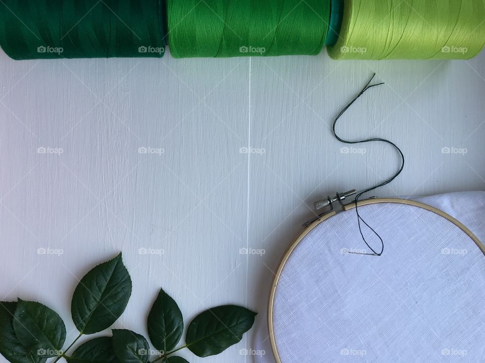 Wooden hoop with white textile for sewing and embroidery 
