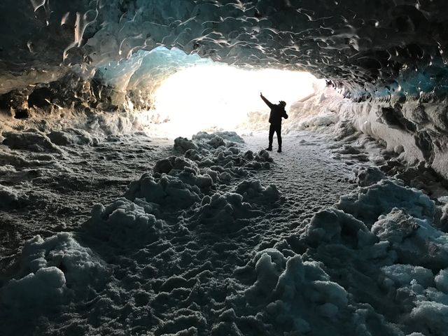 Figure in Cave Opening