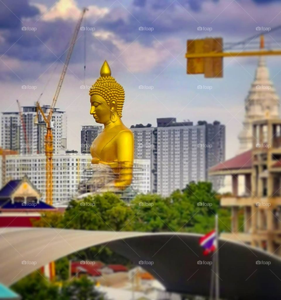 A view of the giant Buddha at Wat Paknam in Bangkok, Thailand. Photo was taken from the BTS sky train.