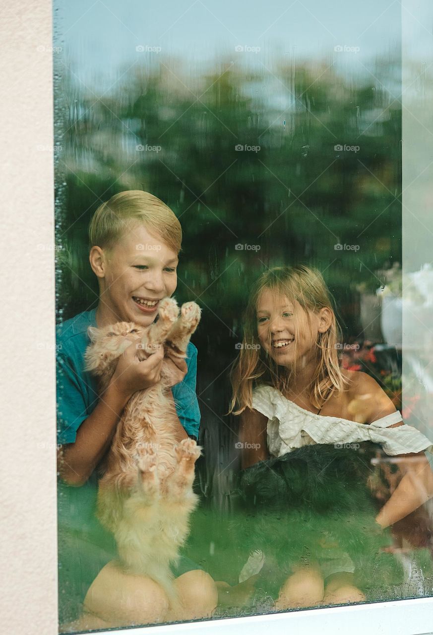 children near the window