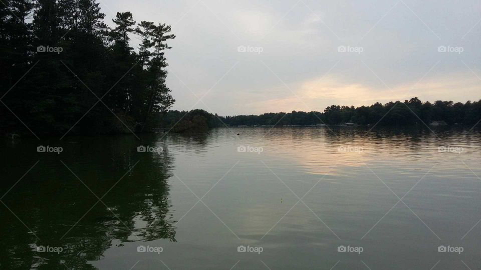 Scenic view of lake at sunset