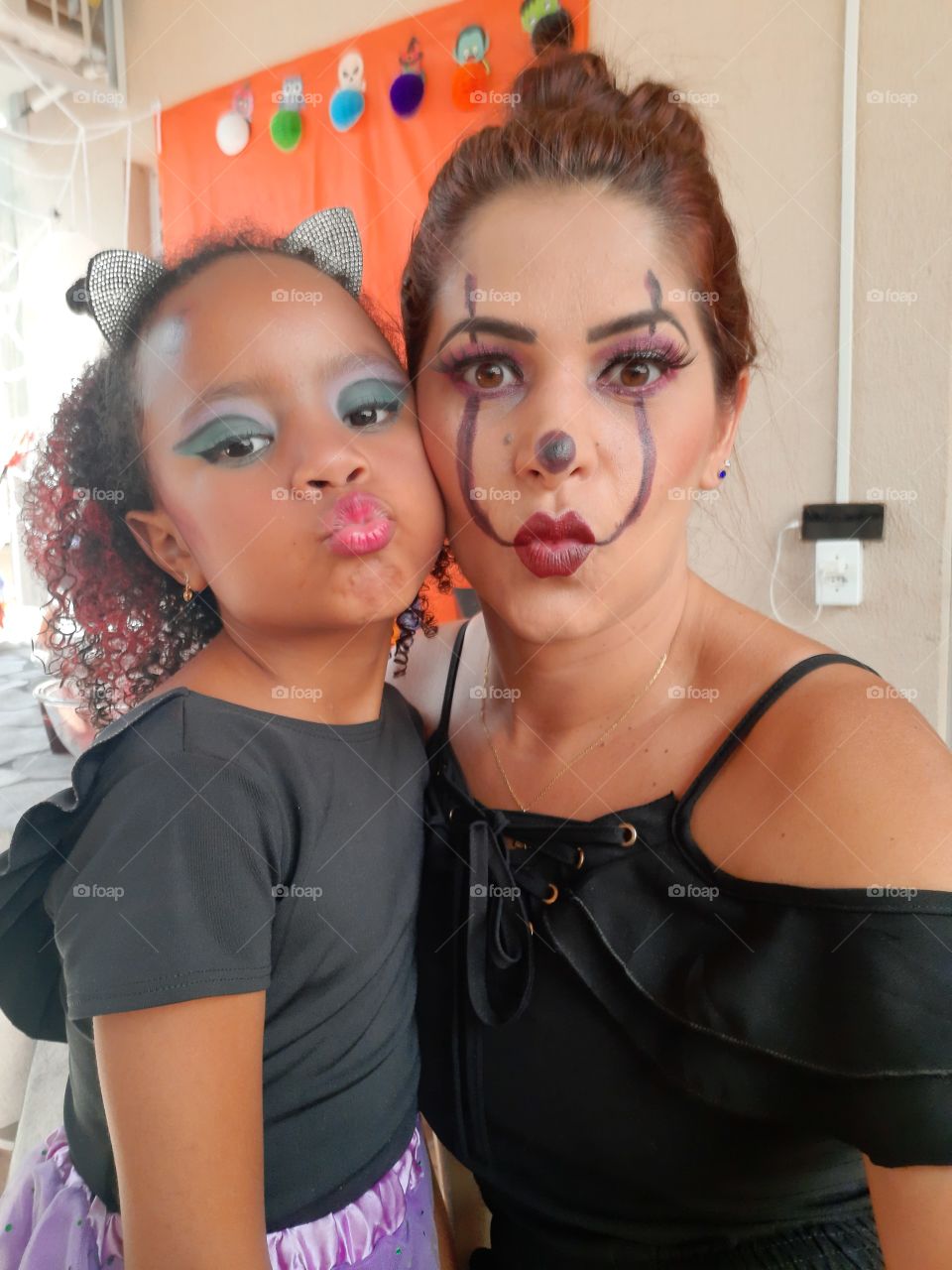 pretty girl and aunt dressed in halloween theme