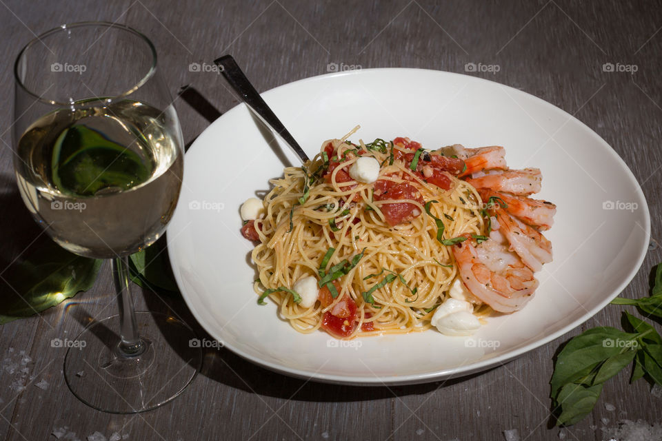 Bowl of Pasta With Glass of White Wine