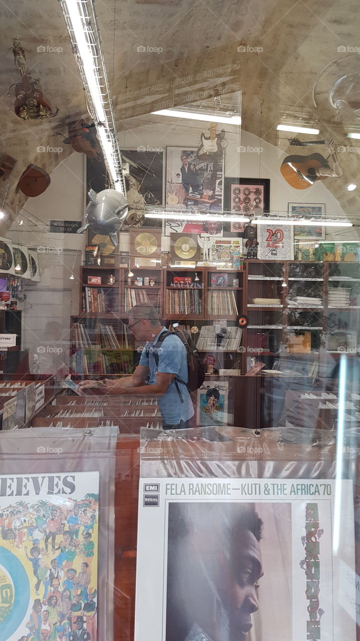 man in a record store in Montpellier, France