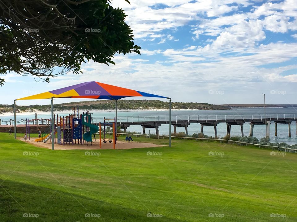 Children's play park outdoors by ocean