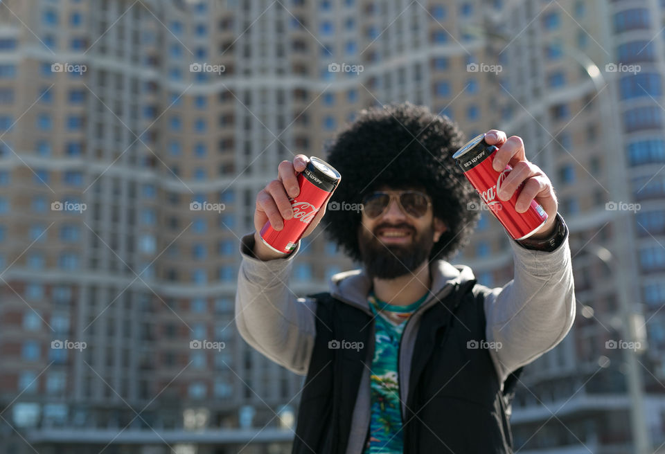 Tasty Coca-Cola, creative boy with bottles of Coca-Cola. 