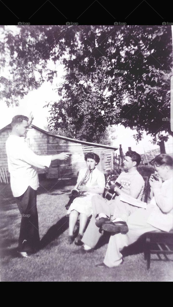 Family Band Conductor Donald, Margaret on Sax, Wilbur playing his Squeeze Box and Vern playing Harmonica 1945