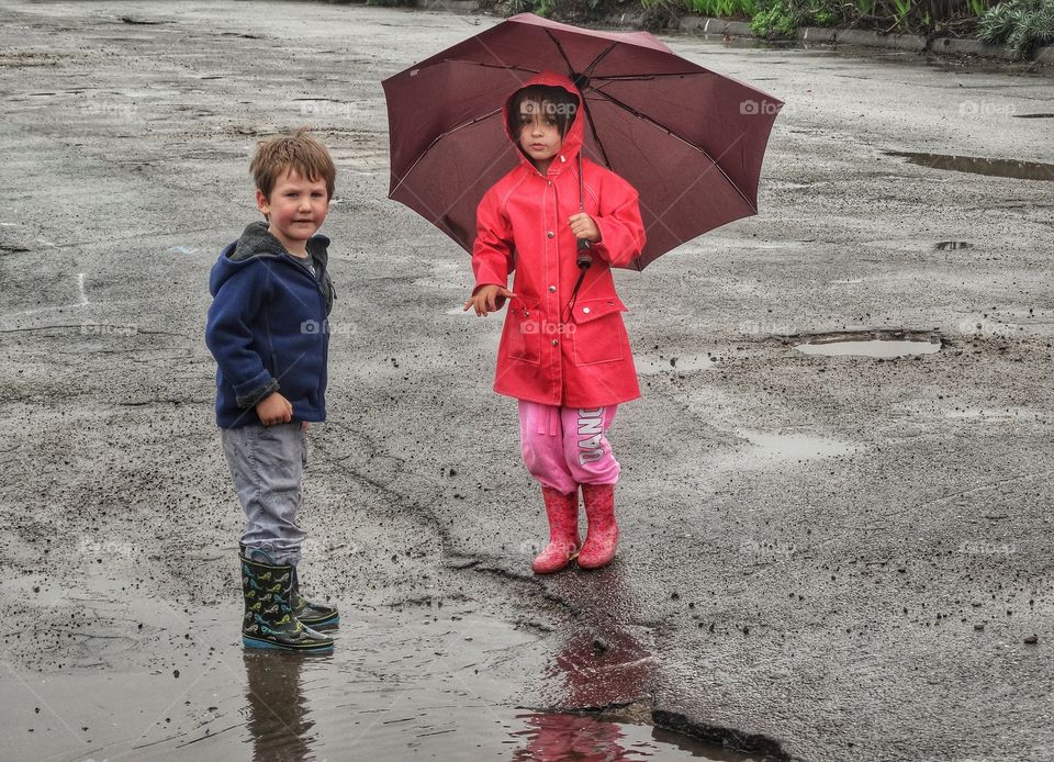 Boy And Girl With Umbrella