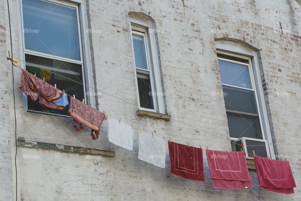 Laundry hanging to dry on an urban clothesline  in Brooklyn, New York City.