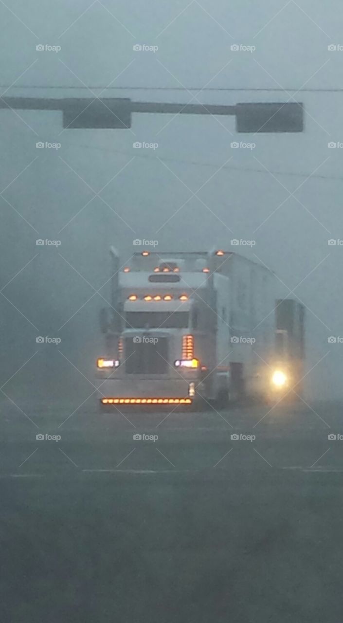 18 wheeler in the morning fog