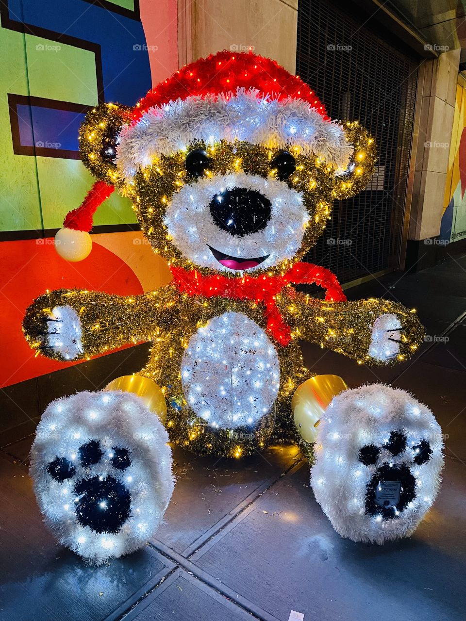 Giant Toys - Larger than life light sculpture of a classic Christmas toy,  the Teddy Bear, adds cheer to the bustling city sidewalk.