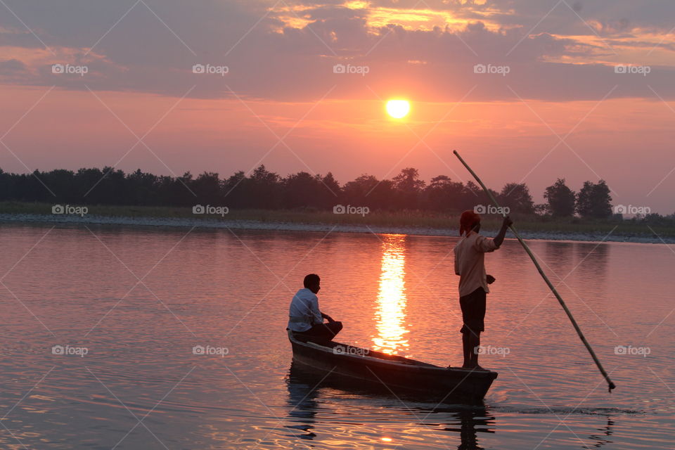 sunset and fisher man