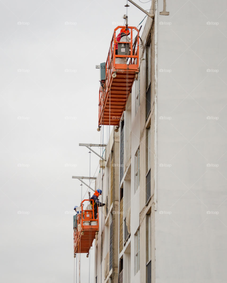 workers on the scaffolding