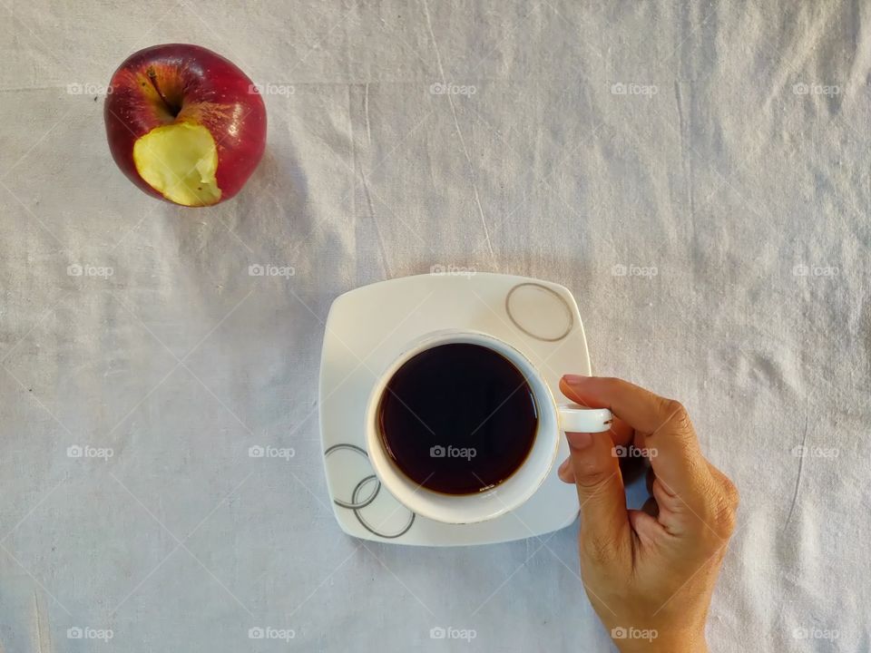 black coffee and Apple on a desk. the most healthy way to kick start your day.. what's your favorite?