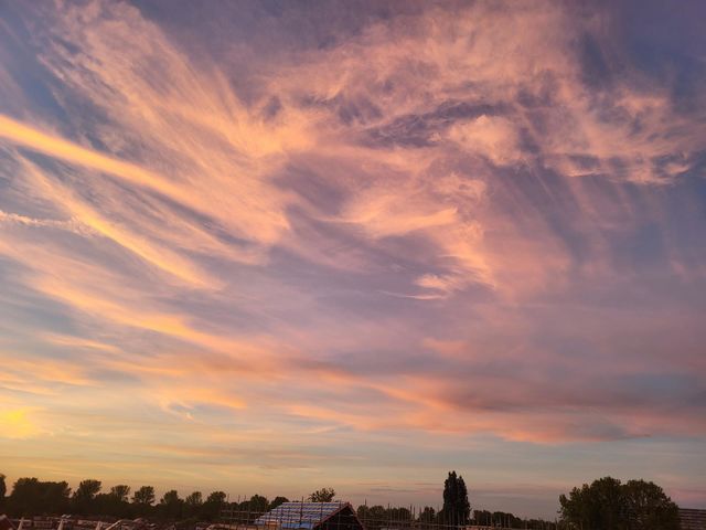 The sky is painting beautiful colors and amazing figures on sunset this evening.As if an eye look upstairs while a man walk to the left