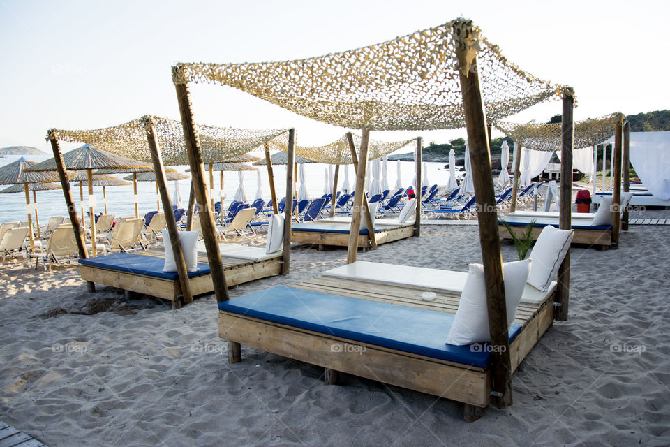 deck chairs on beach. modern designed seck chairs on beach