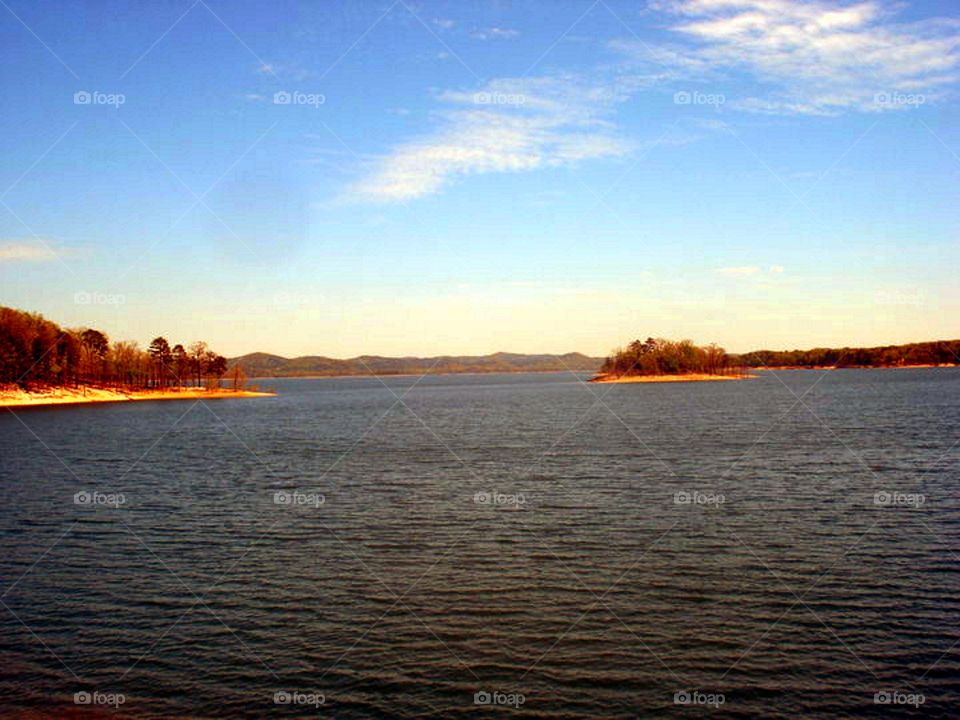 Scenic view of sea against blue sky