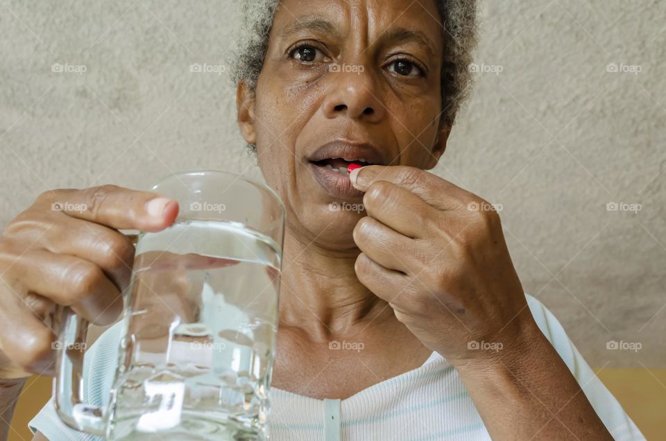 Woman Taking Tablet