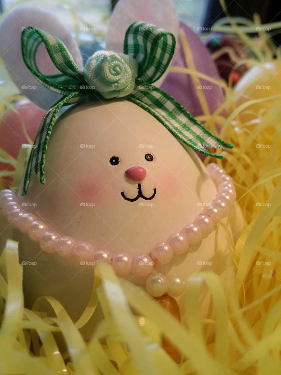An egg dressed up like an Easter bunny