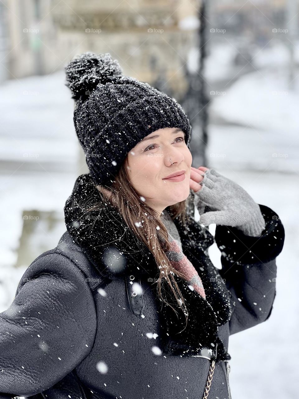 Young women outside in the snow on a cold winter day