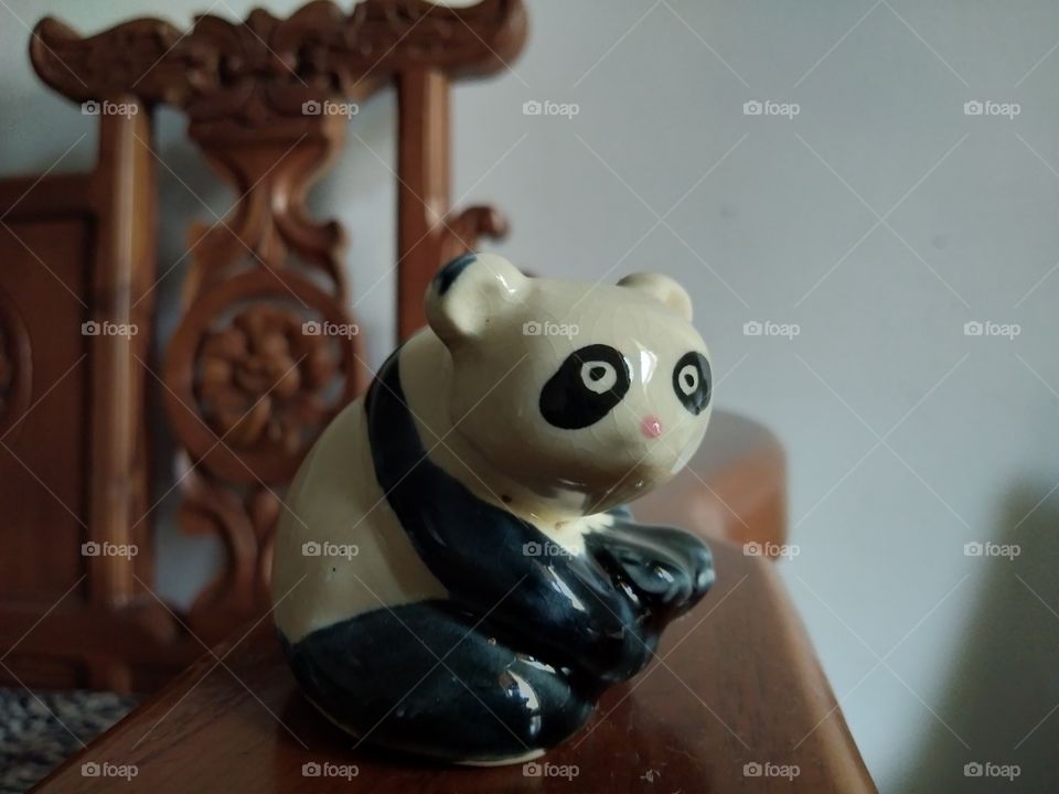 cute little panda. sculpture made of earth. beautiful and gorgeous