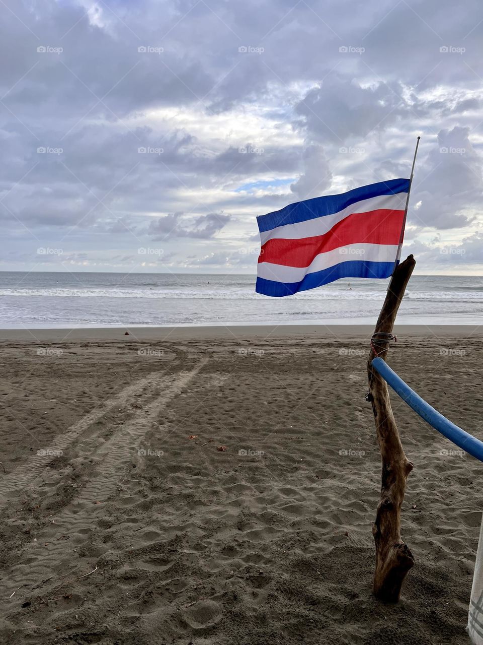 Costa Rica flag against sea 