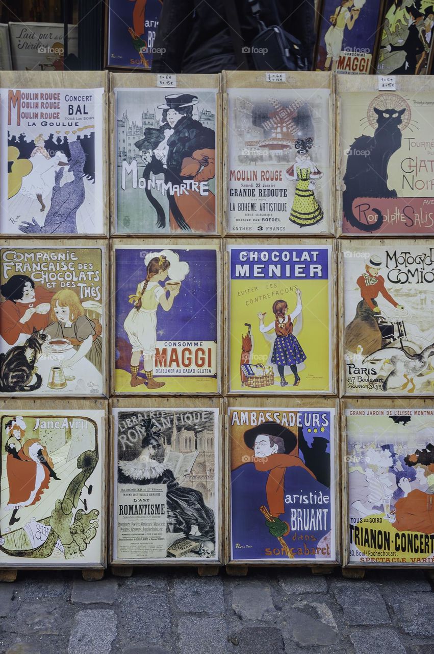 Art prints on display on the street in Paris. 