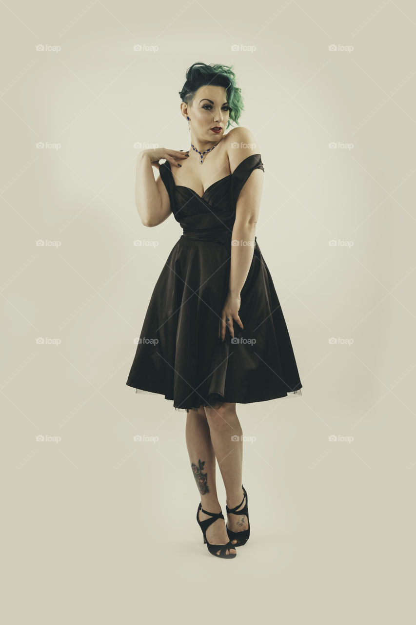 Roughly based on the 1950s era in Hollywood this Portrait was shot in a studio. Fabulous period dress. 