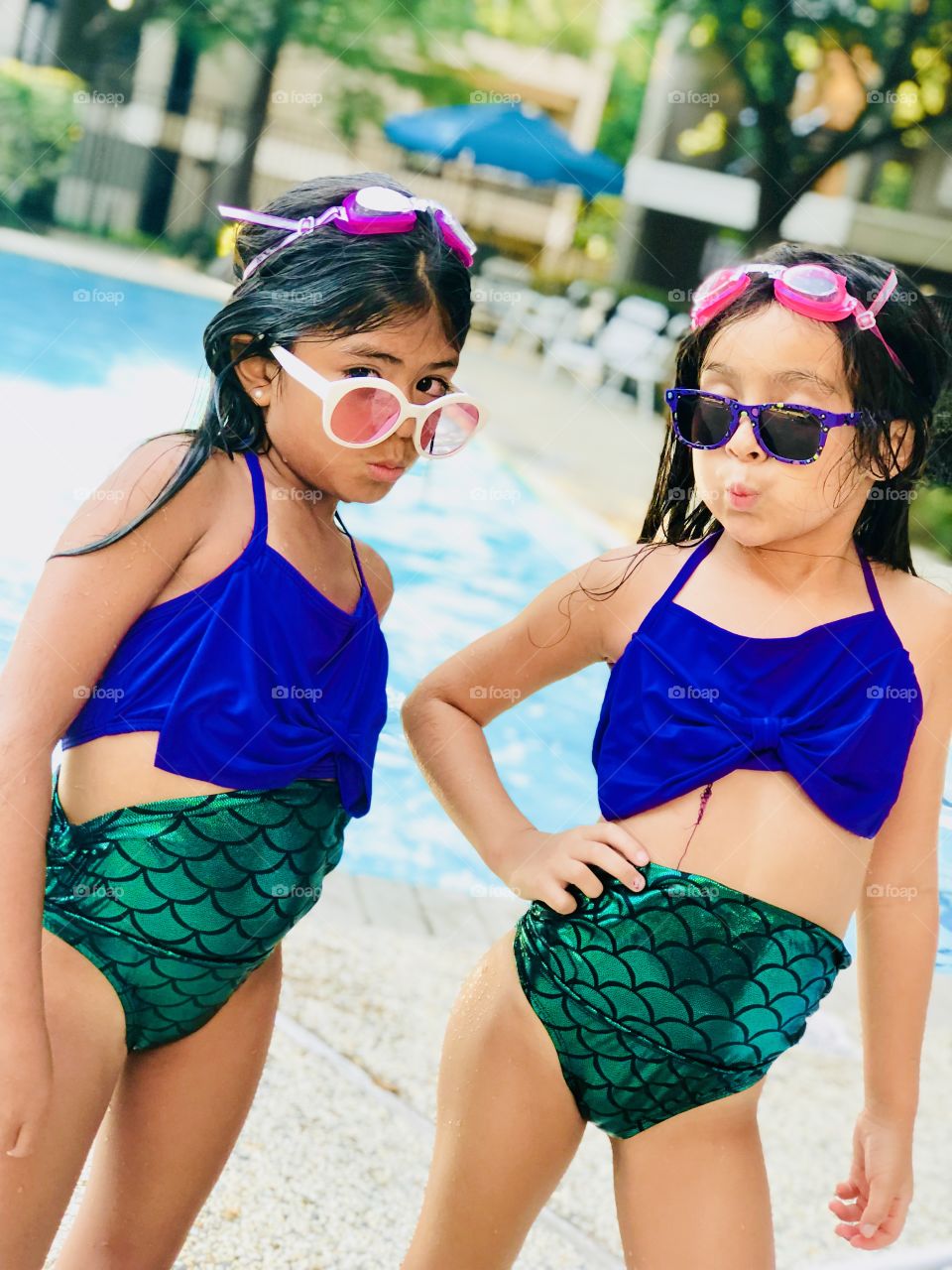 Daughters being sassy at the pool this summer